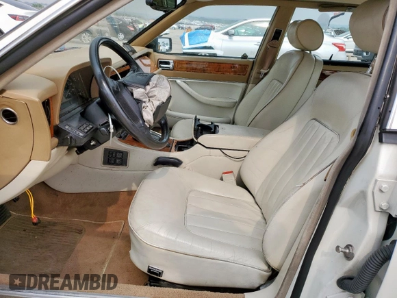 1994 Jaguar XJ with VIN SAJKX1743RC698636, listed as a Copart auction lot 56376685 with 192,928 mi miles and Salvage title. Bid and sale history available at DreamBid. Image 7.
