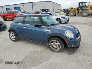 2010 MINI Hardtop S with VIN WMWMF7C51ATZ69061, listed as a Copart auction lot 60837465 with 102,506 mi miles and Salvage title. Bid and sale history available at DreamBid. Image 4.