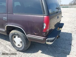 1997 Chevrolet Tahoe with VIN 1GNEK13R5VJ386701, listed as a IAAI auction lot 42046195 with 241,735 mi miles. Bid and sale history available at carsss.com. Image 6.
