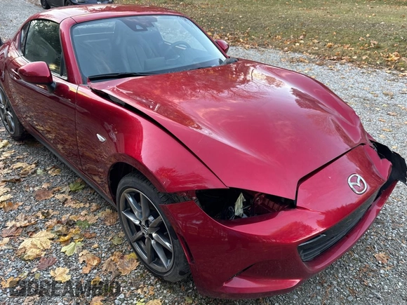2021 Mazda MX-5 Miata Grand Touring z VIN JM1NDAM74M0461263, wystawiony jako Copart lot #81410634 z przebiegiem 44 551 mil mil oraz Szkoda całkowita • Salvage title. Historia ofert i sprzedaży dostępna na DreamBid. Obrazek 1.