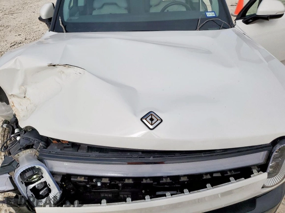 2023 Rivian R1S Adventure z VIN 7PDSGABA4PN026056, wystawiony jako Copart lot #56892495 z przebiegiem Nie podano mil oraz Szkoda całkowita • Salvage title. Historia ofert i sprzedaży dostępna na DreamBid. Obrazek 12.