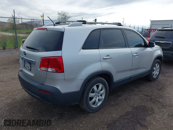 2012 Kia Sorento LX with VIN 5XYKT4A61CG215217, listed as a IAAI auction lot 42103645 with 200,758 mi miles. Bid and sale history available at carsss.com. Image 4.