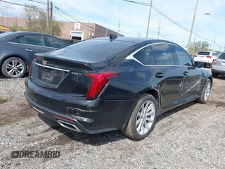 2021 Cadillac CT5 Luxury z VIN 1G6DX5RKXM0146235, wystawiony jako IAAI lot #42214676 z przebiegiem 72 847 mil mil oraz . Historia ofert i sprzedaży dostępna na DreamBid. Obrazek 4.