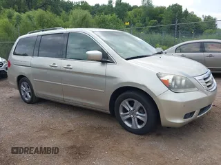 2008 Honda Odyssey Touring with VIN 5FNRL38968B066911, listed as a IAAI auction lot 42818801 with 199,655 mi miles and . Bid and sale history available at DreamBid. Image 1.