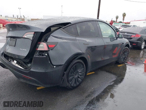 2024 Tesla Model Y Long Range with VIN 7SAYGDEE5RA241433, listed as a IAAI auction lot 41569277 with 7,490 mi miles. Bid and sale history available at carsss.com. Image 4.