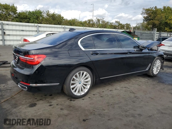2018 BMW 7 Series 740i with VIN WBA7E2C59JB216290, listed as a Copart auction lot 89082215 with 56,020 mi miles and Salvage Title. Bid and sale history available at carsss.com. Image 3.