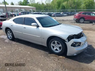 2010 Dodge Charger SXT with VIN 2B3CA3CV9AH311637, listed as a IAAI auction lot 42079657 with 187,683 mi miles. Bid and sale history available at carsss.com. Image 1.