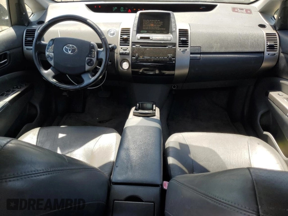 2007 Toyota Prius z VIN JTDKB20U473211597, wystawiony jako Copart lot #58437915 z przebiegiem 252 737 mil mil oraz Szkoda całkowita • Salvage title. Historia ofert i sprzedaży dostępna na DreamBid. Obrazek 8.