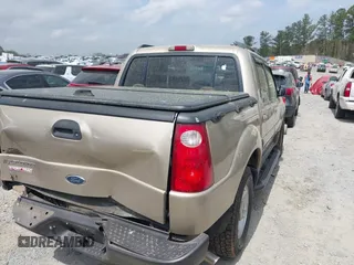 2002 Ford Explorer Sport Trac Value z VIN 1FMZU67E32UB39918, wystawiony jako IAAI lot #41937332 z przebiegiem 201 713 mil mil oraz . Historia ofert i sprzedaży dostępna na DreamBid. Obrazek 4.