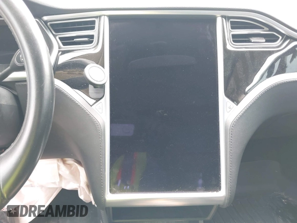 2013 Tesla Model S with VIN 5YJSA1CG9DFP27357, listed as a IAAI auction lot 42362514 with Not provided miles and . Bid and sale history available at DreamBid. Image 17.
