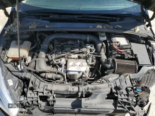 2018 Ford Focus SE z VIN 1FADP3FEXJL256542, wystawiony jako Copart lot #54583915 z przebiegiem 107 774 mil mil oraz Szkoda całkowita • Salvage title. Historia ofert i sprzedaży dostępna na DreamBid. Obrazek 11.