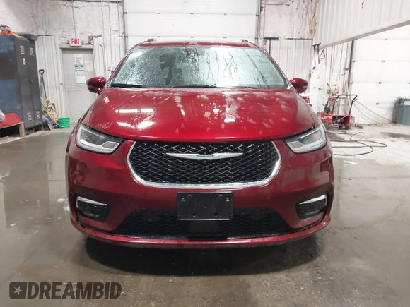 2021 Chrysler Pacifica Hybrid Touring L with VIN 2C4RC1L71MR581260, listed as a IAAI auction lot 42014401 with 68,719 mi miles and . Bid and sale history available at DreamBid. Image 12.