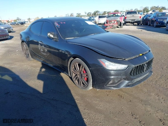 2021 Maserati Ghibli S with VIN ZAM57YSA3M1365483, listed as a IAAI auction lot 41488486 with 51,954 mi miles. Bid and sale history available at carsss.com. Image 1.