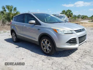 2013 Ford Escape SEL with VIN 1FMCU9HX5DUB71179, listed as a IAAI auction lot 42169071 with 176,095 mi miles. Bid and sale history available at carsss.com. Image 1.