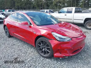 2020 Tesla Model 3 Standard Range Plus z VIN 5YJ3E1EA2LF738149, wystawiony jako IAAI lot #42146736 z przebiegiem 33 799 mil mil oraz . Historia ofert i sprzedaży dostępna na DreamBid. Obrazek 1.