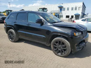 2019 Jeep Grand Cherokee Altitude with VIN 1C4RJFAG5KC813144, listed as a Copart auction lot 62295595 with 140,986 mi miles and Salvage title. Bid and sale history available at DreamBid. Image 4.