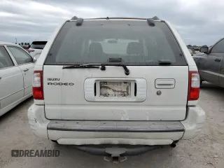 2002 Isuzu Rodeo S with VIN 4S2DM58W324327147, listed as a Copart auction lot 75194104 with Not Provided miles and Salvage Title. Bid and sale history available at DreamBid. Image 6.