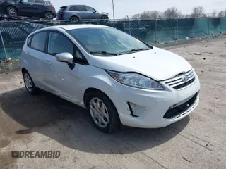 2011 Ford Fiesta SE with VIN 3FADP4EJ3BM233463, listed as a IAAI auction lot 41948437 with 218,386 mi miles. Bid and sale history available at carsss.com. Image 1.