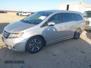 2014 Honda Odyssey Touring with VIN 5FNRL5H97EB094353, listed as a IAAI auction lot 41701712 with 141,228 mi miles and . Bid and sale history available at DreamBid. Image 21.
