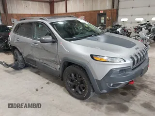 2015 Jeep Cherokee Trailhawk z VIN 1C4PJMBS7FW703229, wystawiony jako IAAI lot #42517389 z przebiegiem 94 496 mil mil oraz . Historia ofert i sprzedaży dostępna na DreamBid. Obrazek 1.