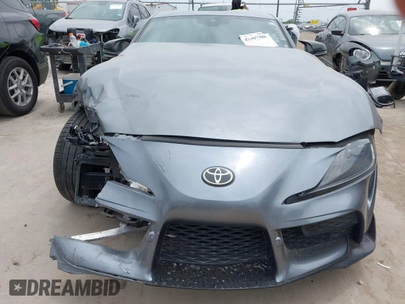 2021 Toyota Supra 2.0 with VIN WZ1DB2C0XMW038679, listed as a IAAI auction lot 42407988 with 76,316 mi miles and . Bid and sale history available at DreamBid. Image 13.