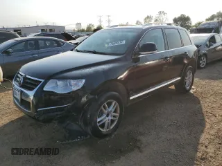 2010 Volkswagen Touareg VR6 with VIN WVGBF7A9XAD001790, listed as a Copart auction lot 70806534 with 90,103 mi miles and Salvage Title. Bid and sale history available at DreamBid. Image 1.