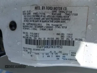 2007 Ford Focus S z VIN 1FAFP34N37W319953, wystawiony jako IAAI lot #41737822 z przebiegiem 208 801 mil mil oraz . Historia ofert i sprzedaży dostępna na DreamBid. Obrazek 9.