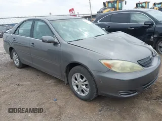 2004 Toyota Camry LE with VIN 4T1BF32KX4U575854, listed as a IAAI auction lot 41690613 with 264,186 mi miles. Bid and sale history available at carsss.com. Image 1.