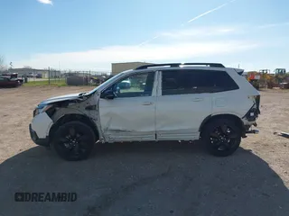 2019 Honda Passport Elite z VIN 5FNYF8H0XKB001472, wystawiony jako IAAI lot #42143890 z przebiegiem 98 119 mil mil oraz . Historia ofert i sprzedaży dostępna na DreamBid. Obrazek 15.