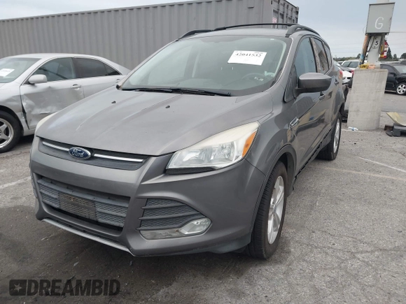 2013 Ford Escape SE with VIN 1FMCU0GX7DUA86521, listed as a IAAI auction lot 42041532 with 108,776 mi miles and . Bid and sale history available at DreamBid. Image 2.