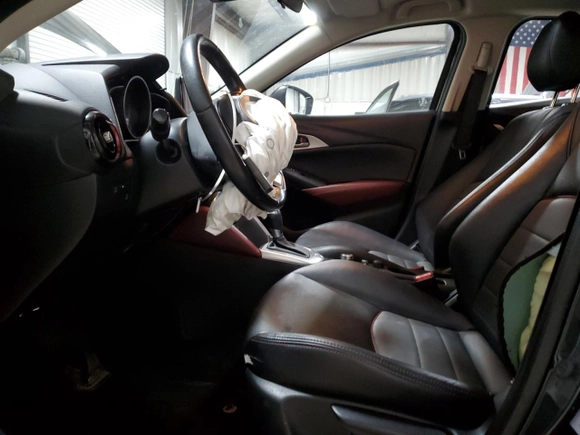 2018 Mazda CX-3 Touring z VIN JM1DKFC75J0301307, wystawiony jako Copart lot #56302175 z przebiegiem 107 676 mil mil oraz Szkoda całkowita • Salvage title. Historia ofert i sprzedaży dostępna na DreamBid. Obrazek 7.
