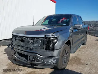 2023 Ford F-150 Lightning Pro with VIN 1FTVW1EL8PWG06781, listed as a IAAI auction lot 41861926 with 27,051 mi miles. Bid and sale history available at carsss.com. Image 2.