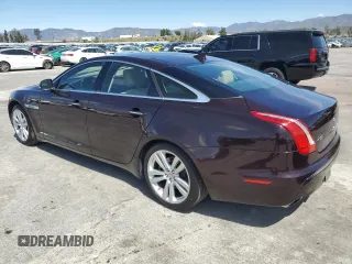 2014 Jaguar XJ with VIN SAJWA1CZ3E8V69877, listed as a Copart auction lot 51520405 with 57,567 mi miles and Clean Title. Bid and sale history available at DreamBid. Image 2.