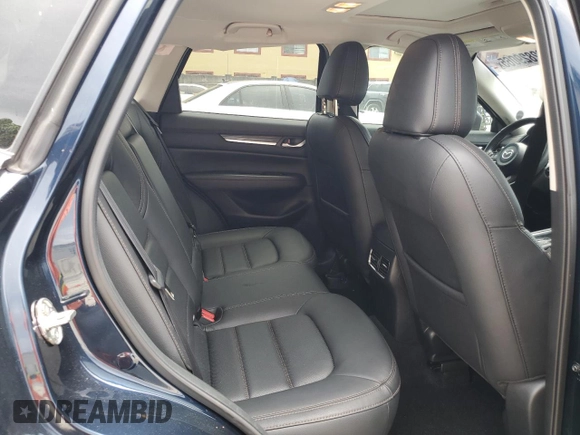 2021 Mazda CX-5 Grand Touring z VIN JM3KFBDM5M0464611, wystawiony jako Copart lot #62829065 z przebiegiem 20 525 mil mil oraz Nie do naprawy • Non repairable. Historia ofert i sprzedaży dostępna na DreamBid. Obrazek 11.
