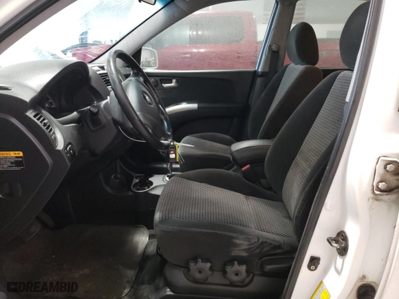 2006 Kia Sportage LX with VIN KNDJF723567196181, listed as a Copart auction lot 86598884 with 169,674 mi miles and Salvage Title. Bid and sale history available at carsss.com. Image 7.