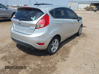 2014 Ford Fiesta SE with VIN 3FADP4EJ4EM151911, listed as a IAAI auction lot 42096321 with 129,938 mi miles and . Bid and sale history available at DreamBid. Image 4.