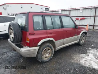 1996 Suzuki Sidekick z VIN JS3TD21V0T4107927, wystawiony jako IAAI lot #41249522 z przebiegiem 225 665 mil mil oraz . Historia ofert i sprzedaży dostępna na DreamBid. Obrazek 4.