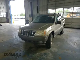 2003 Jeep Grand Cherokee Laredo with VIN 1J4GW48S43C567559, listed as a Copart auction lot 61431595 with 249,998 mi miles and Salvage title. Bid and sale history available at DreamBid. Image 14.