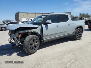 2022 Rivian R1T Adventure z VIN 7FCTGAAAXNN014983, wystawiony jako Copart lot #48987605 z przebiegiem Nie podano mil oraz Szkoda całkowita • Salvage title. Historia ofert i sprzedaży dostępna na DreamBid. Obrazek 1.