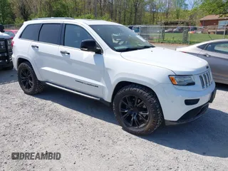 2014 Jeep Grand Cherokee Summit with VIN 1C4RJFJM0EC557473, listed as a IAAI auction lot 42014196 with 165,558 mi miles and . Bid and sale history available at DreamBid. Image 1.