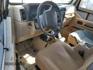 2000 Jeep Wrangler Sahara with VIN 1J4FA59S8YP721771, listed as a Copart auction lot 56924475 with 175,456 mi miles and Clean title. Bid and sale history available at DreamBid. Image 8.