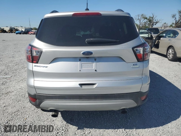 2018 Ford Escape SE with VIN 1FMCU0G98JUB49767, listed as a Copart auction lot 48140885 with 90,906 mi miles and Salvage Title. Bid and sale history available at carsss.com. Image 6.