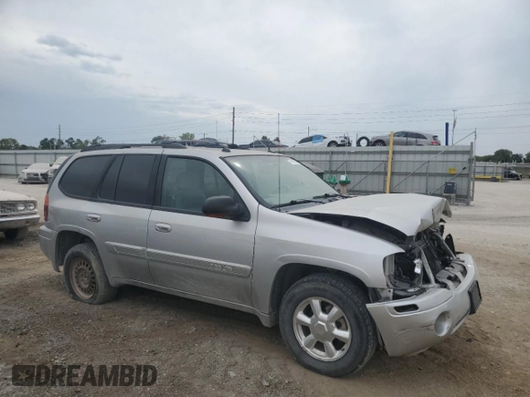 2005 GMC Envoy SLT with VIN 1GKDT13S852330514, listed as a Copart auction lot 71190504 with 203,616 mi miles and Salvage Title. Bid and sale history available at carsss.com. Image 4.