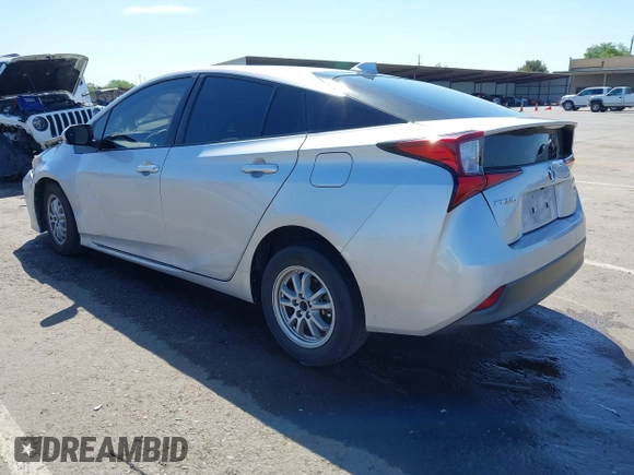 2021 Toyota Prius L Eco with VIN JTDKAMFUXM3144991, listed as a IAAI auction lot 42147025 with 106,466 mi miles and . Bid and sale history available at DreamBid. Image 3.