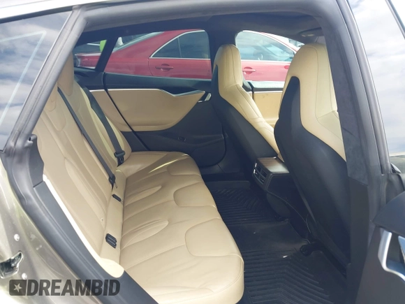 2015 Tesla Model S 85 with VIN 5YJSA1E14FF120455, listed as a IAAI auction lot 42053306 with 62,817 mi miles and . Bid and sale history available at DreamBid. Image 8.