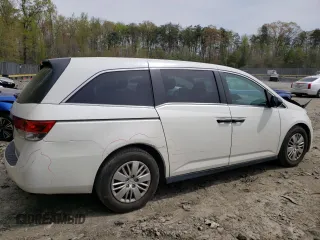 2014 Honda Odyssey LX with VIN 5FNRL5H27EB116435, listed as a Copart auction lot 52864825 with 94,643 mi miles and Salvage Title. Bid and sale history available at DreamBid. Image 3.
