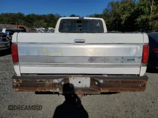 1990 Ford F-250 with VIN 1FTHF26H2LNA64235, listed as a Copart auction lot 74459134 with 249,821 mi miles and Salvage Title. Bid and sale history available at carsss.com. Image 6.