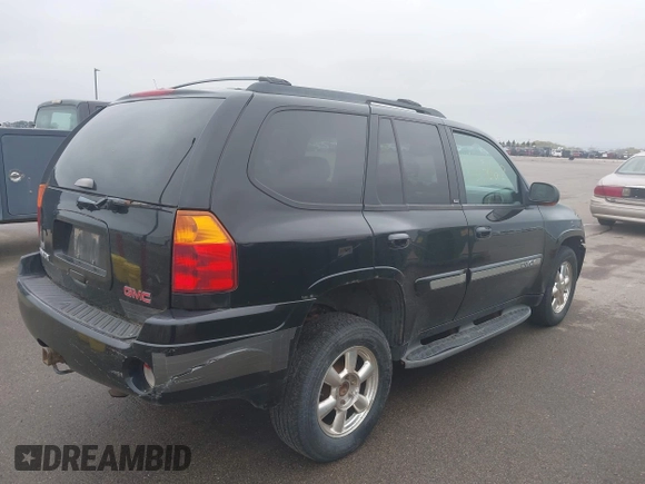 2002 GMC Envoy SLT with VIN 1GKDT13S222143135, listed as a IAAI auction lot 42136672 with 206,064 mi miles. Bid and sale history available at carsss.com. Image 4.