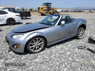 2010 Mazda MX-5 Miata Grand Touring with VIN JM1NC2FF5A0205190, listed as a Copart auction lot 61372455 with 147,852 mi miles and Salvage title. Bid and sale history available at DreamBid. Image 1.