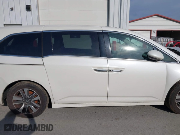 2014 Honda Odyssey Touring with VIN 5FNRL5H94EB001479, listed as a IAAI auction lot 41123678 with 147,269 mi miles and . Bid and sale history available at carsss.com. Image 13.